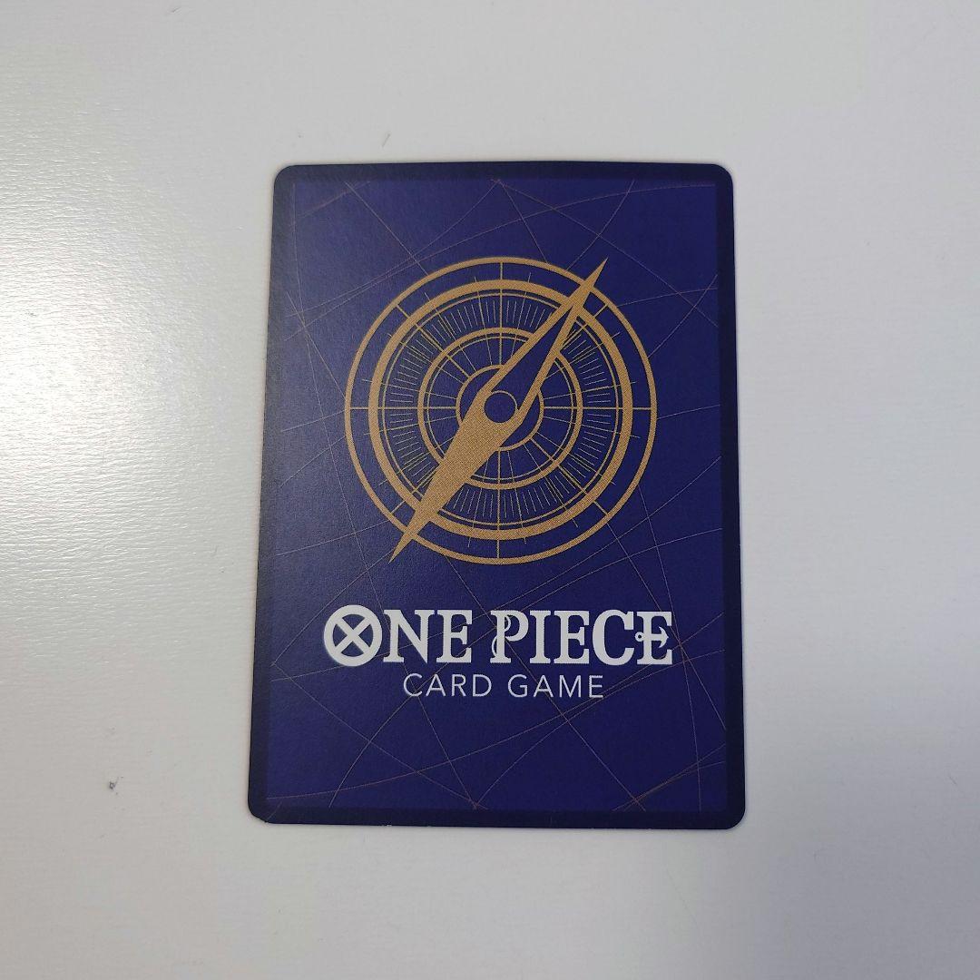 Bandai Monkey D. Luffy P-033 promo card from Japan stored in a card case with visible slight corner bends