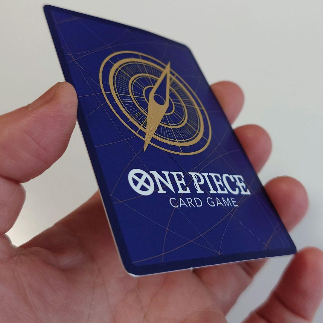 Bandai Monkey D. Luffy P-033 promo card from Japan stored in a card case with visible slight corner bends