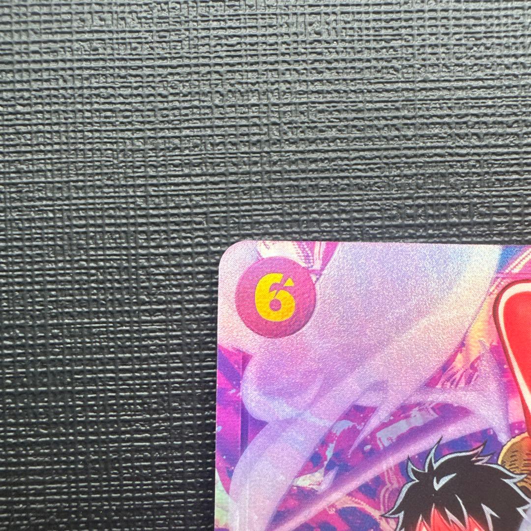 One Piece Monkey D. Luffy SEC Parallel EB02-061 trading card with slight scuffing and two small chips