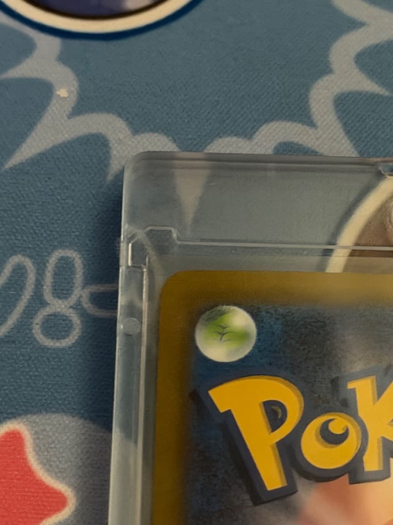 Pokemon Card MuEX SAR SV2a 151 with serial number 205/165 stored in a loader