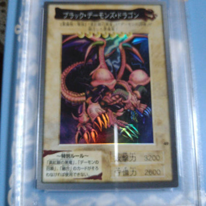 Bandai 1998 Black Demons Dragon trading card graded PSA 8 NM-MT with visible corner wear