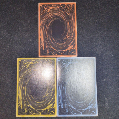 Bandai Yu-Gi-Oh GBI Secret Rare trading cards set featuring Osiris The Sky Dragon, Obelisk The Giant God Soldier, and Ra Winged Dragon of Ra