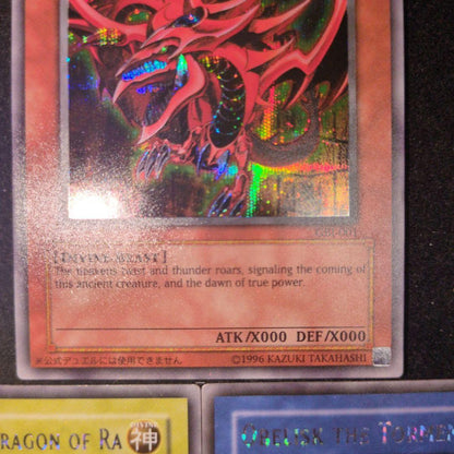 Bandai Yu-Gi-Oh GBI Secret Rare trading cards set featuring Osiris The Sky Dragon, Obelisk The Giant God Soldier, and Ra Winged Dragon of Ra