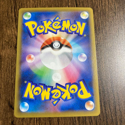 Pokemon Card Mew V in clean condition showing detailed artwork and text