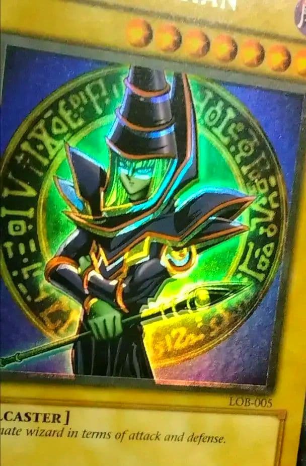 Bandai Yu-Gi-Oh Dark Magician LOB Error Faded Foil Shift PSA 9 single card with faded yellow color