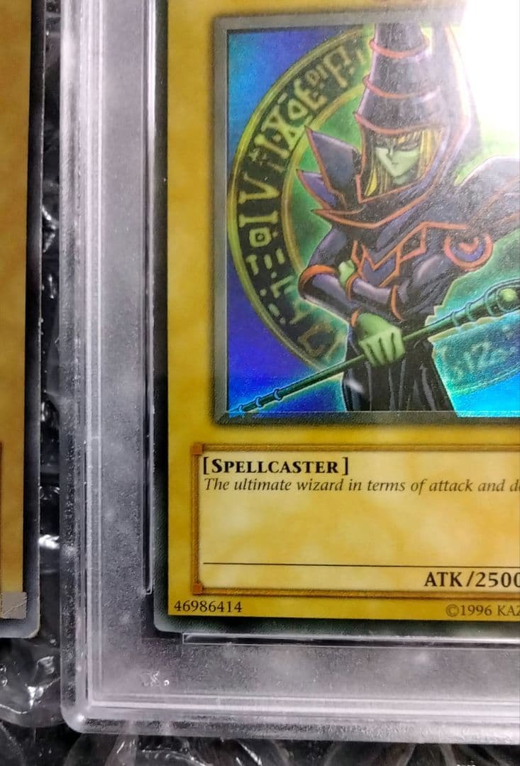 Bandai Yu-Gi-Oh Dark Magician LOB Error Faded Foil Shift PSA 9 single card with faded yellow color