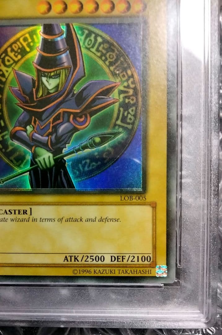 Bandai Yu-Gi-Oh Dark Magician LOB Error Faded Foil Shift PSA 9 single card with faded yellow color