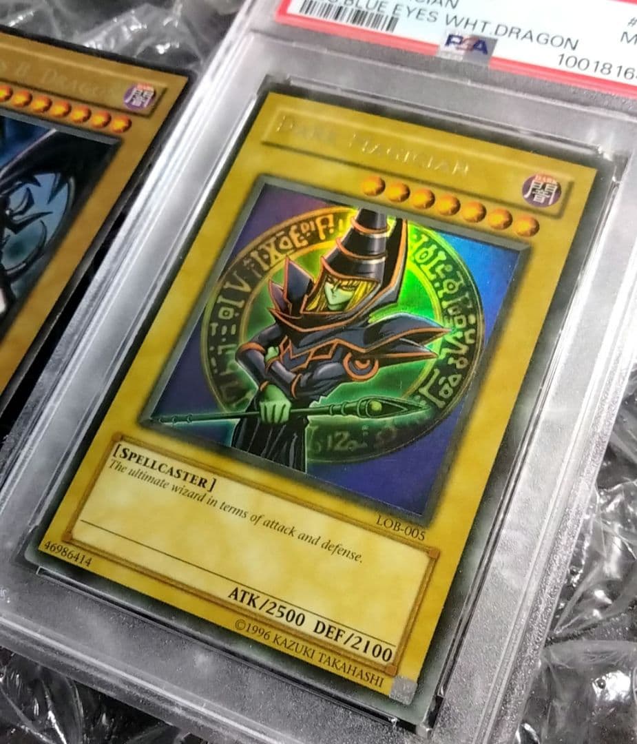 Bandai Yu-Gi-Oh Dark Magician LOB Error Faded Foil Shift PSA 9 single card with faded yellow color