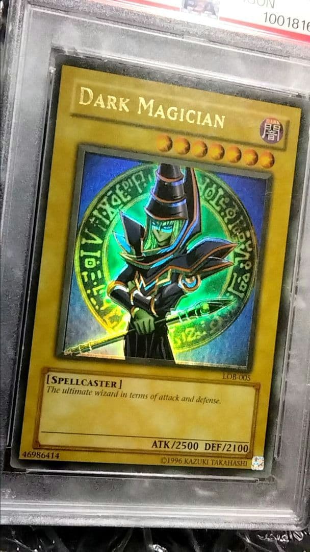 Bandai Yu-Gi-Oh Dark Magician LOB Error Faded Foil Shift PSA 9 single card with faded yellow color