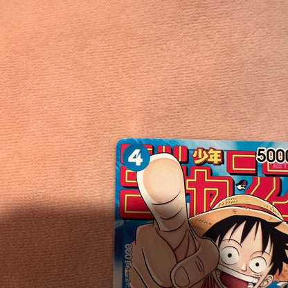 Used One Piece Monkey D. Luffy P-033 Weekly Shonen Jump trading card with slight wear and white fade mark