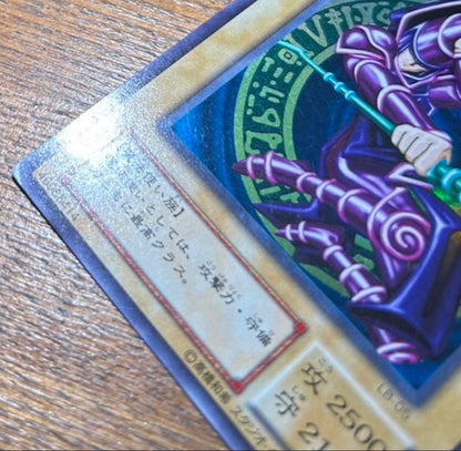 Yugioh Black Magician LB-05 Ultra Rare 2nd Edition Japanese collectible card with visible scratches and scuffs
