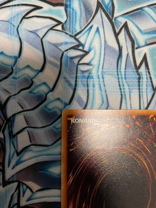 Yugioh Red-Eyes Black Dragon Relief vintage trading card with minor wear, shown in protective sleeve