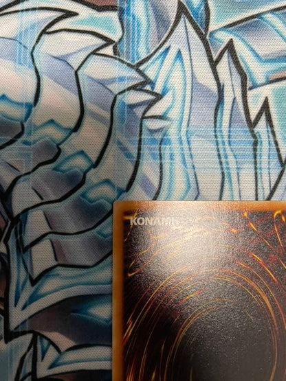Yugioh Red-Eyes Black Dragon Relief vintage trading card with minor wear, shown in protective sleeve