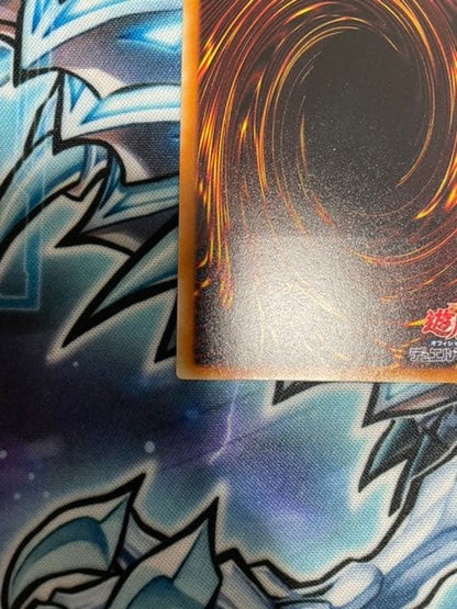 Yugioh Red-Eyes Black Dragon Relief vintage trading card with minor wear, shown in protective sleeve
