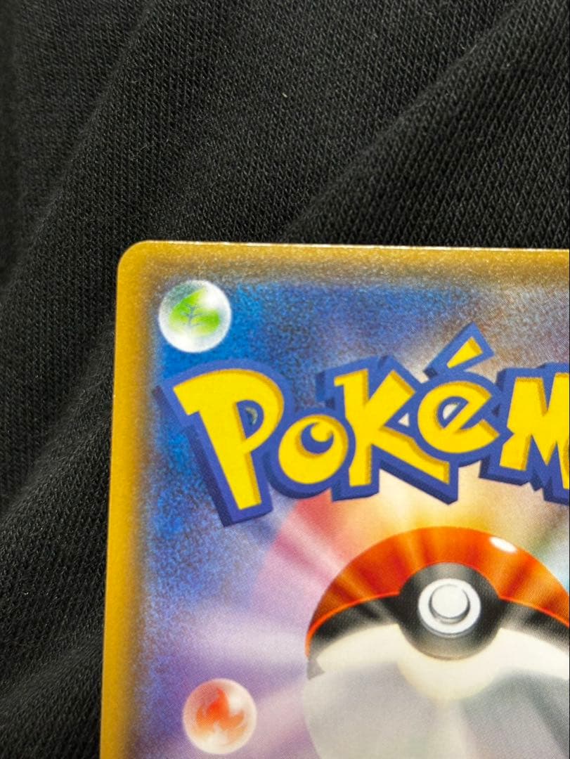 Pokemon promotional card featuring Eevee wearing a poncho with slight crease and small chip