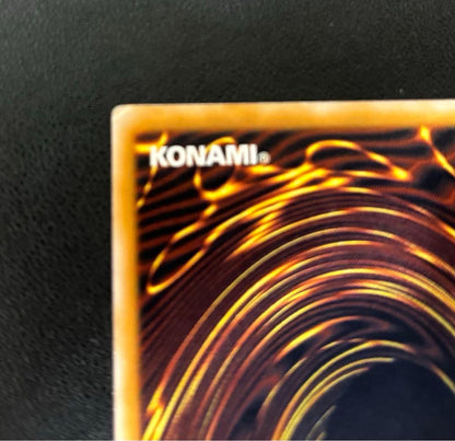 Blue-Eyes White Dragon relief card with 3000 attack power showing slight crease in upper right corner