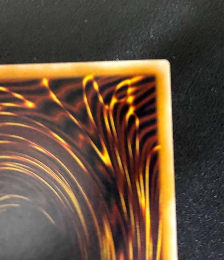 Blue-Eyes White Dragon relief card with 3000 attack power showing slight crease in upper right corner