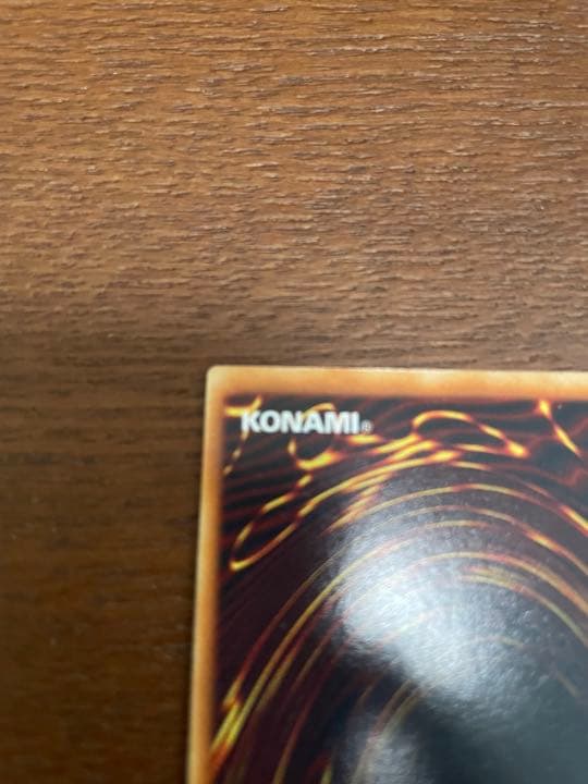 Yu-Gi-Oh Blue-Eyes White Dragon Initial Ultra Rare trading card with minor surface scratches