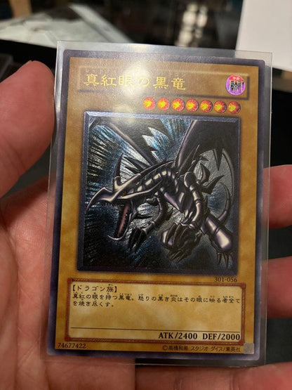 Yu-Gi-Oh Crimson Dark Dragon Relief Ultra Rare 301-056 card showing dark attribute dragon with 2400 attack