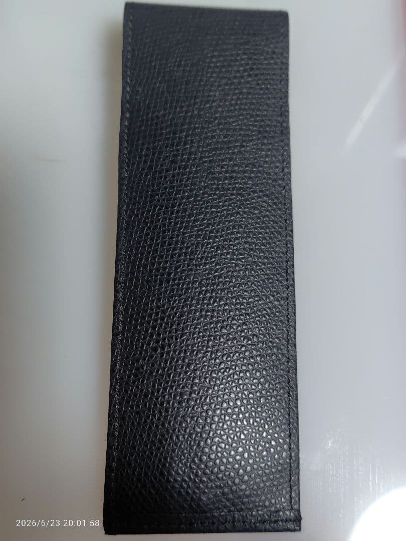 Black genuine leather Cross pen case with flap closure and embossed logo, slim profile business accessory