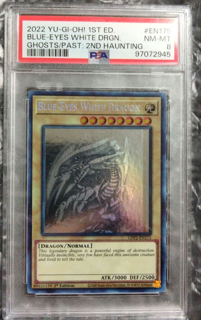Blue-Eyes White Dragon GFTP English Error Card PSA8 with blacked-out artwork edge and shifted print