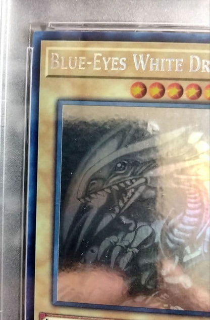 Blue-Eyes White Dragon GFTP English Error Card PSA8 with blacked-out artwork edge and shifted print