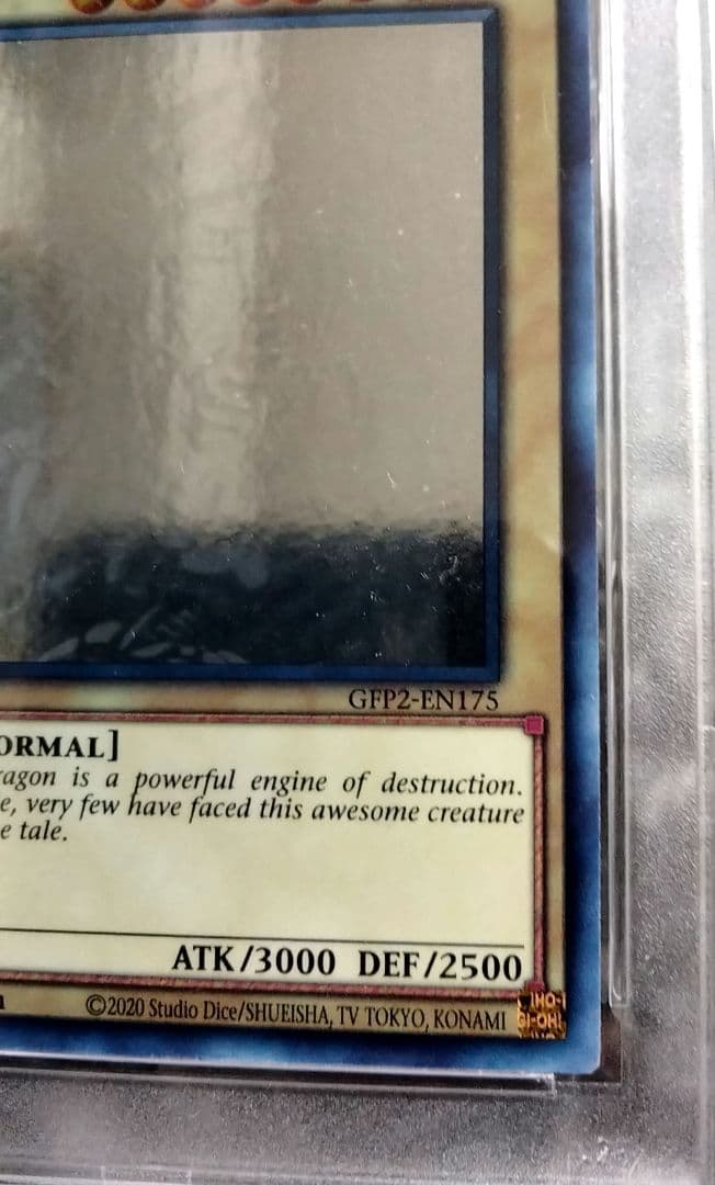 Blue-Eyes White Dragon GFTP English Error Card PSA8 with blacked-out artwork edge and shifted print