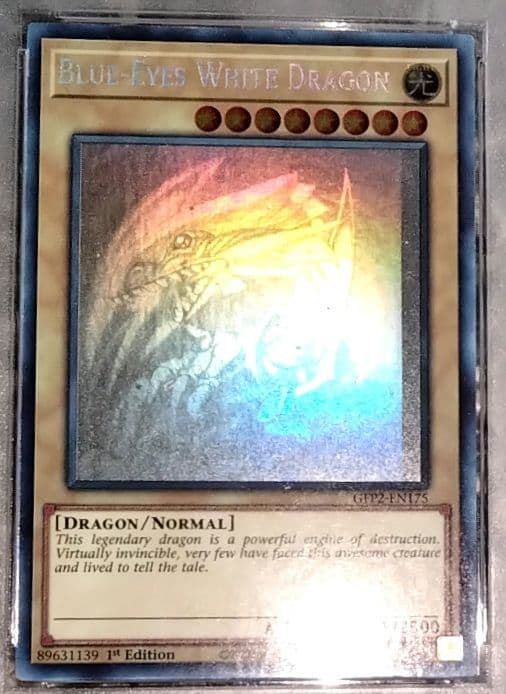 Blue-Eyes White Dragon GFTP English Error Card PSA8 with blacked-out artwork edge and shifted print