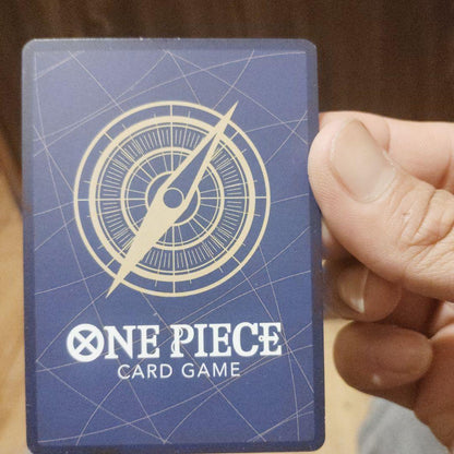 One Piece Monkey D. Luffy character card P-043 wearing a crown with power 7000 and strike attribute