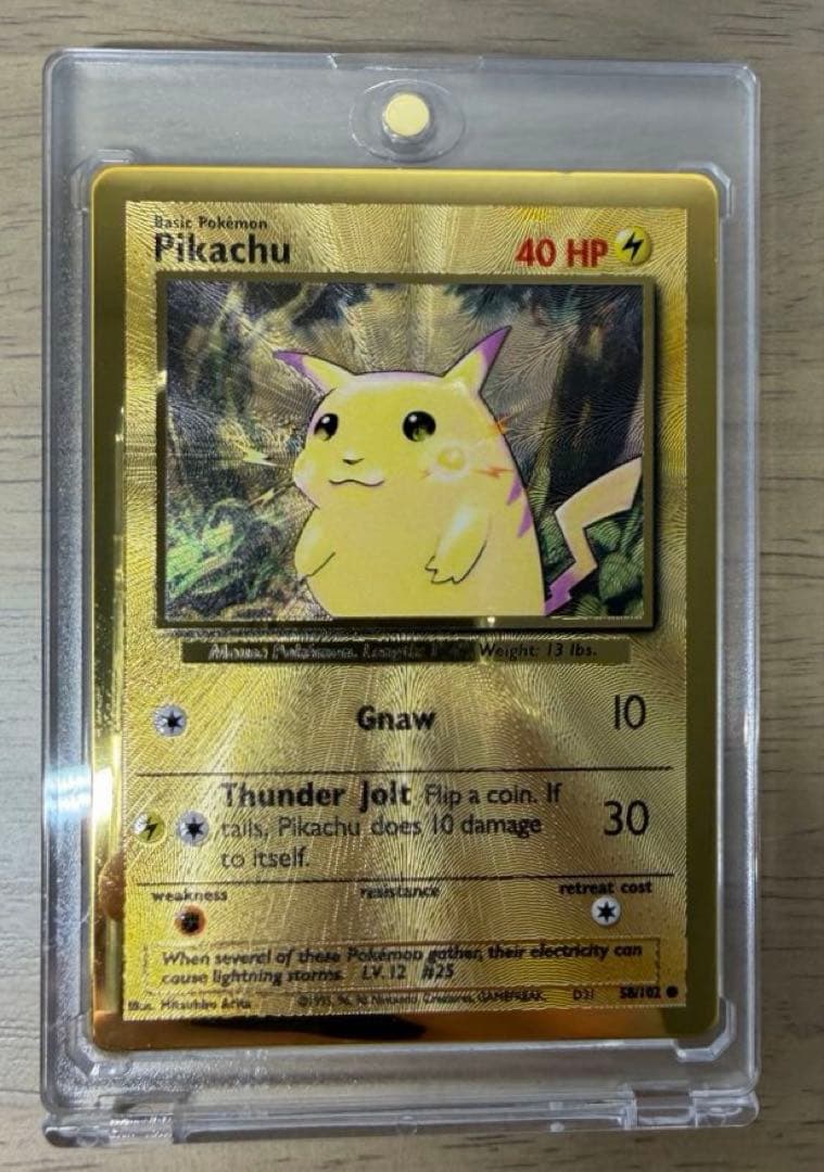 Bandai Pikachu 25th Ultra Premium Metal Collection collectible card with protective inner sleeve and loader