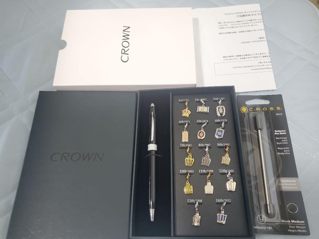 Toyota Crown Cross black ballpoint pen with 14 historic emblem charms and dedicated case