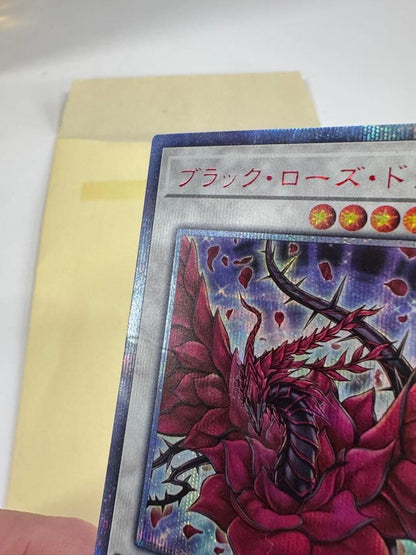 Yu-Gi-Oh Black Rose Dragon 20th Secret Rare card with visible surface mark near center