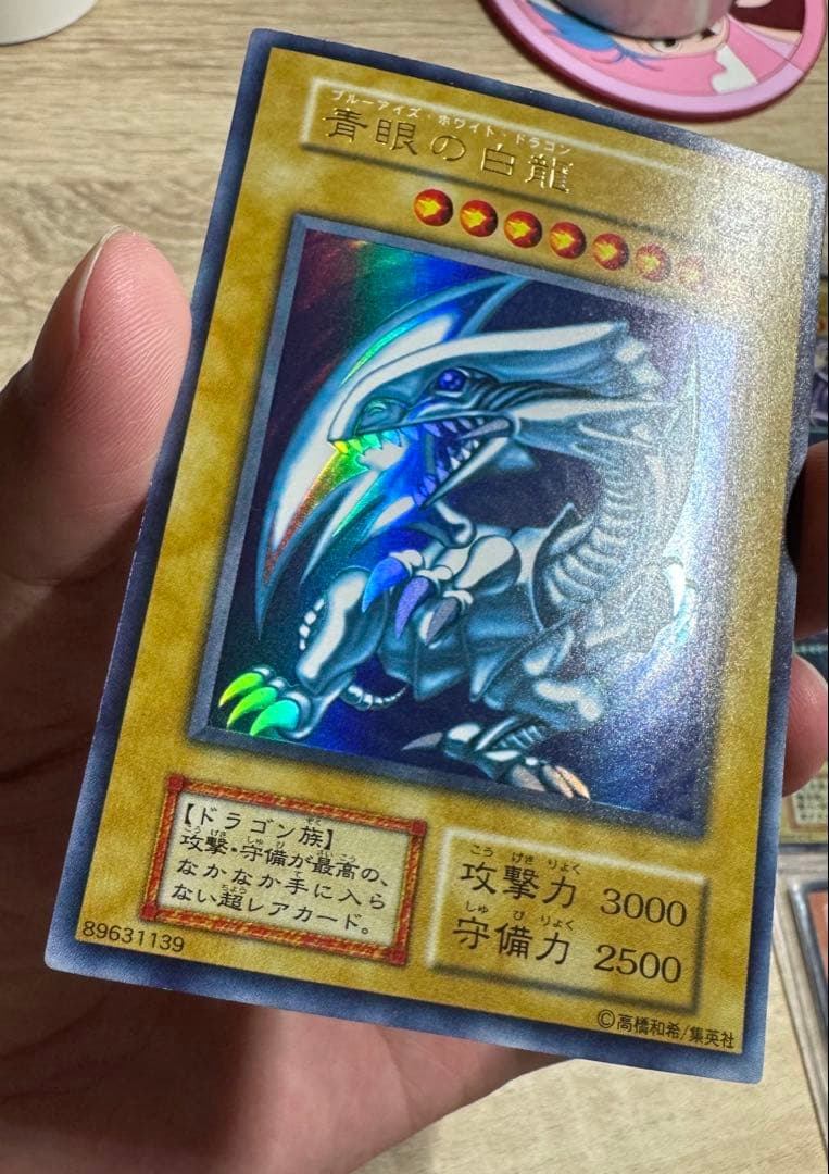 Blue-Eyes White Dragon Ultra Rare Initial Edition Yu-Gi-Oh trading card graded PSA8 in protective case