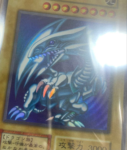 Blue-Eyes White Dragon Ultra Rare Initial Edition Yu-Gi-Oh trading card graded PSA8 in protective case