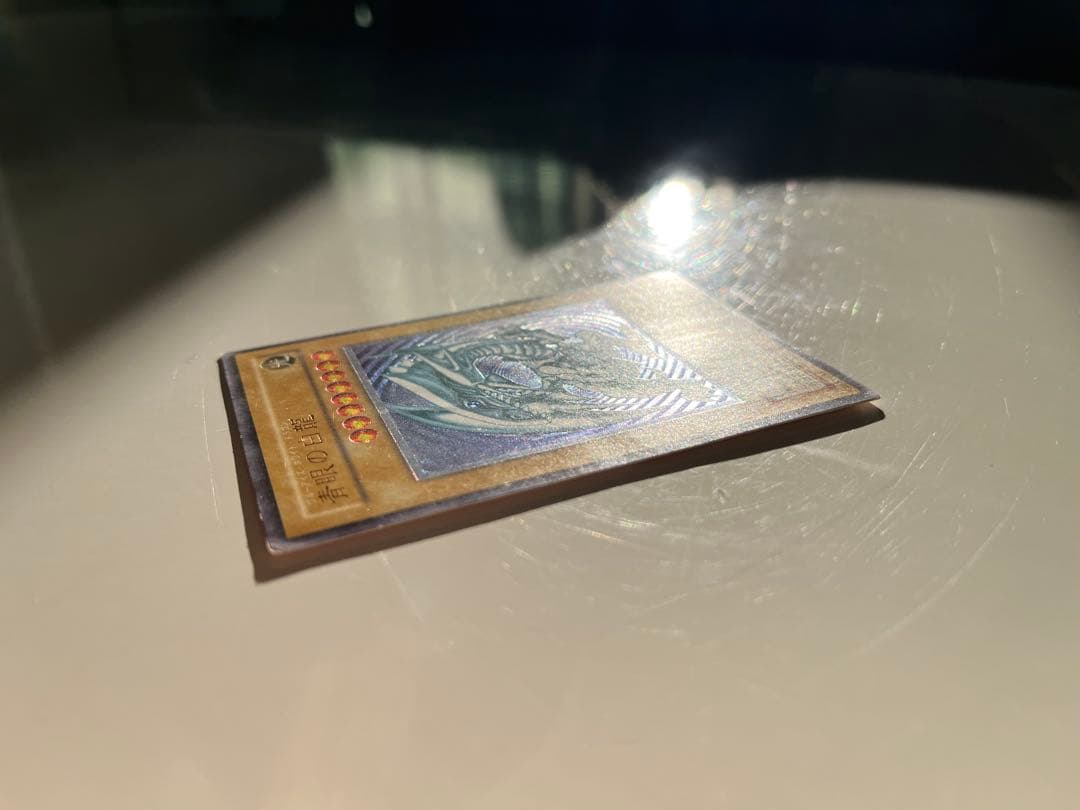 Yugioh Blue-Eyes White Dragon Relief SM-51 trading card with some minor scratches