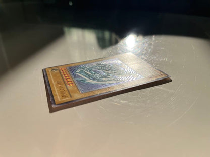 Yugioh Blue-Eyes White Dragon Relief SM-51 trading card with some minor scratches