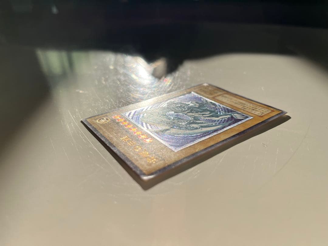 Yugioh Blue-Eyes White Dragon Relief SM-51 trading card with some minor scratches