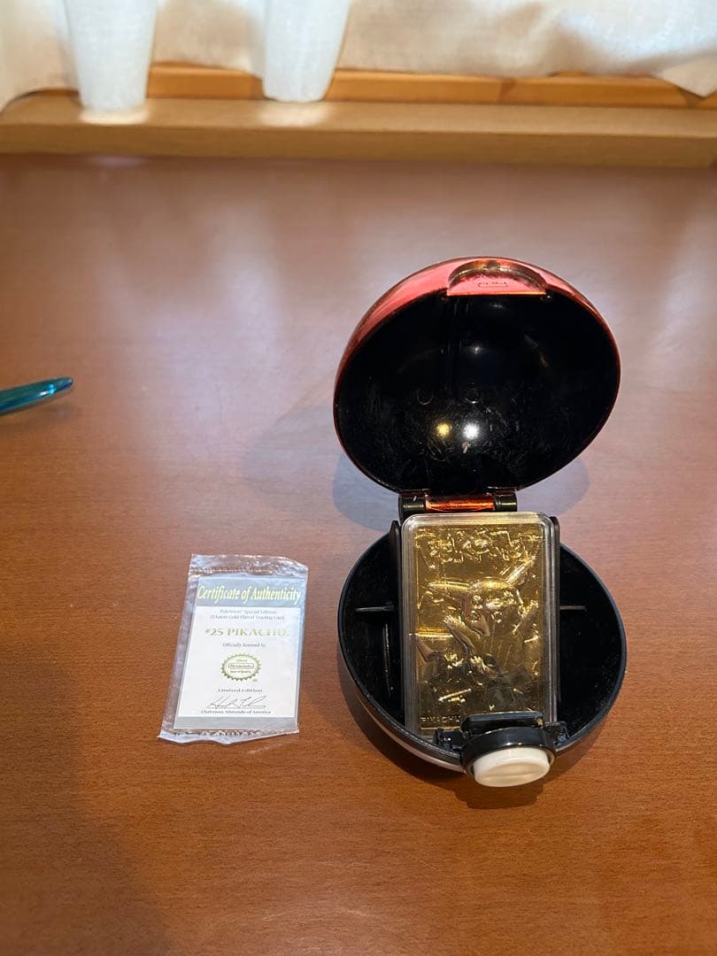 Rare 23K gold-plated Pikachu collectible card from 1999 Burger King US sale with Poké Ball case