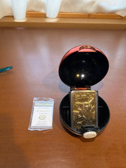 Rare 23K gold-plated Pikachu collectible card from 1999 Burger King US sale with Poké Ball case