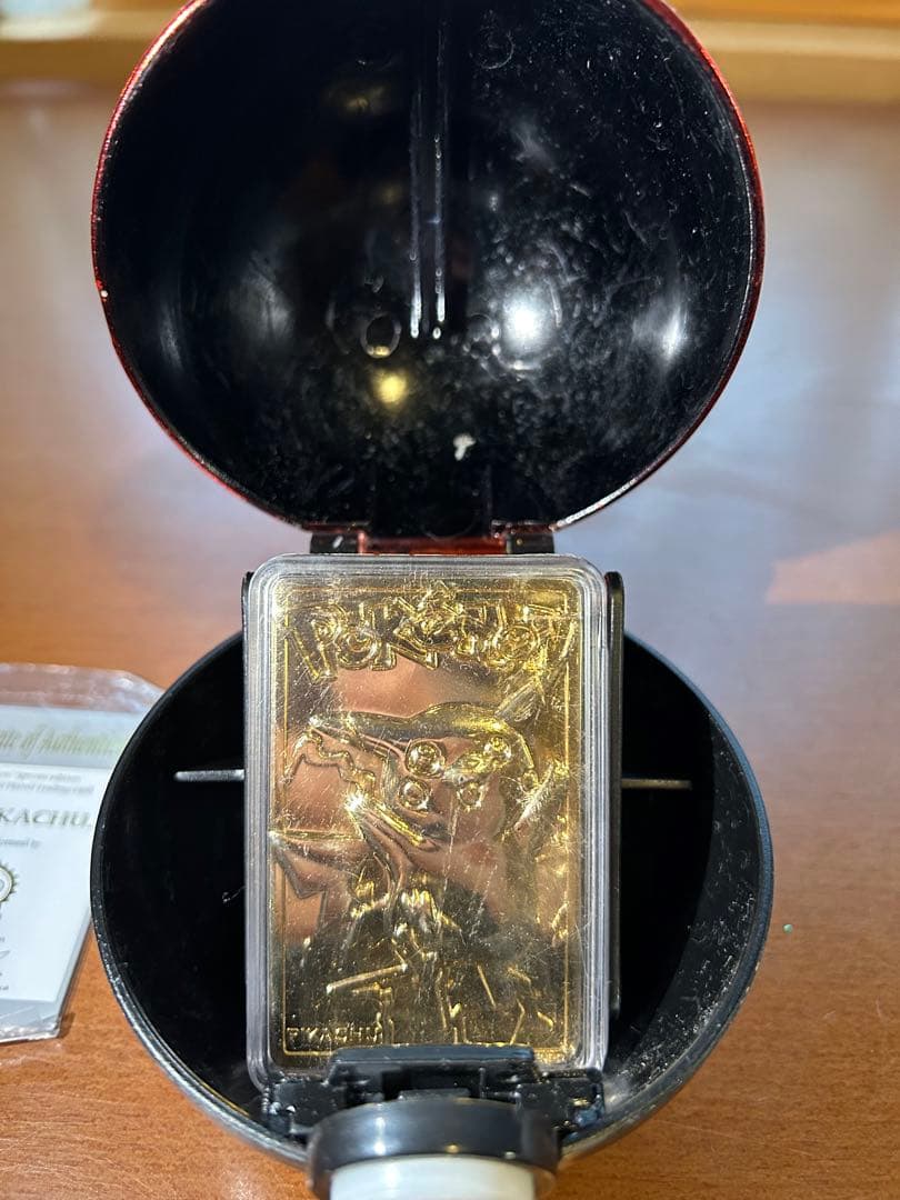 Rare 23K gold-plated Pikachu collectible card from 1999 Burger King US sale with Poké Ball case