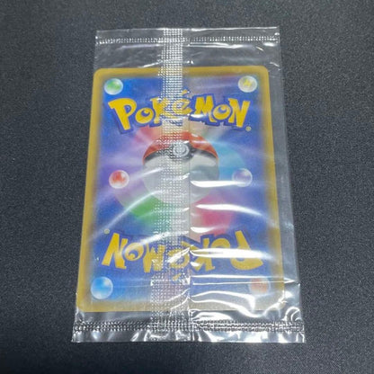 Unopened Pokemon Pikachu Surprising Voltage promo card from Japan with light reflection and white marks