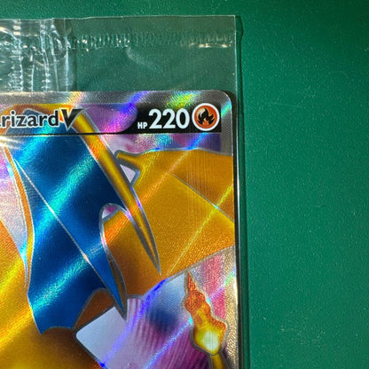 Unopened Charizard V Promo SWSH050 trading card with model number and brand visible