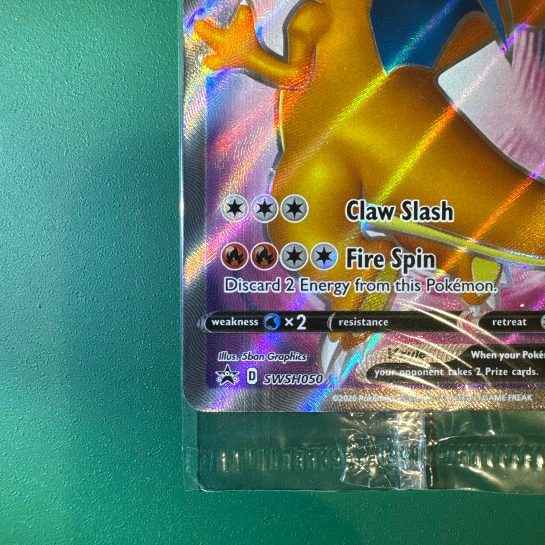 Unopened Charizard V Promo SWSH050 trading card with model number and brand visible