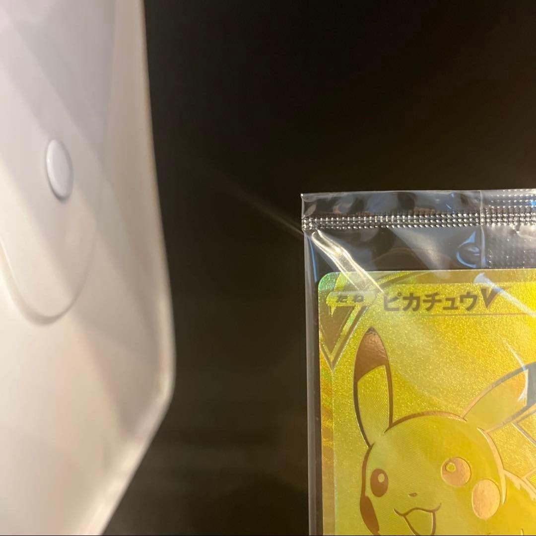 Unopened 25th anniversary Pokemon Golden Pikachu collectible card in hard case from Golden Box series