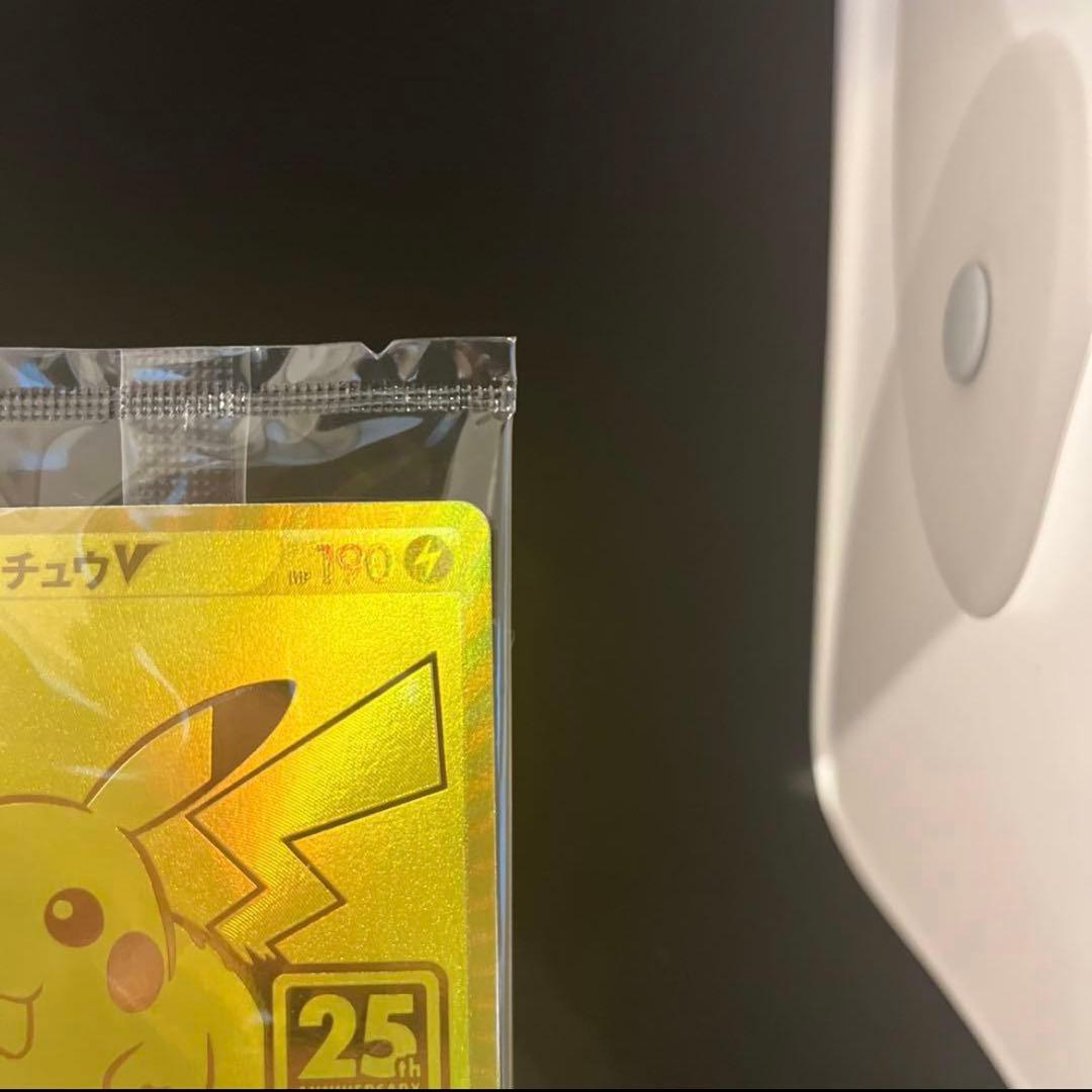 Unopened 25th anniversary Pokemon Golden Pikachu collectible card in hard case from Golden Box series
