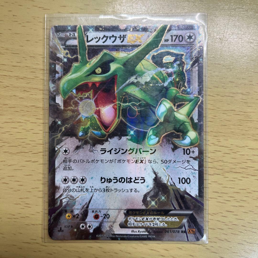Bulk Pokemon cards spread out showing various card designs and characters stored after opening
