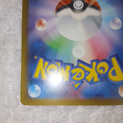 Classic Pokemon Charizard card with clean surface and small chip on upper right corner of the back