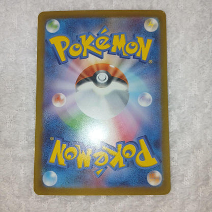 Classic Pokemon Charizard card with clean surface and small chip on upper right corner of the back