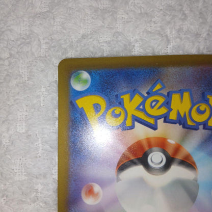 Classic Pokemon Charizard card with clean surface and small chip on upper right corner of the back