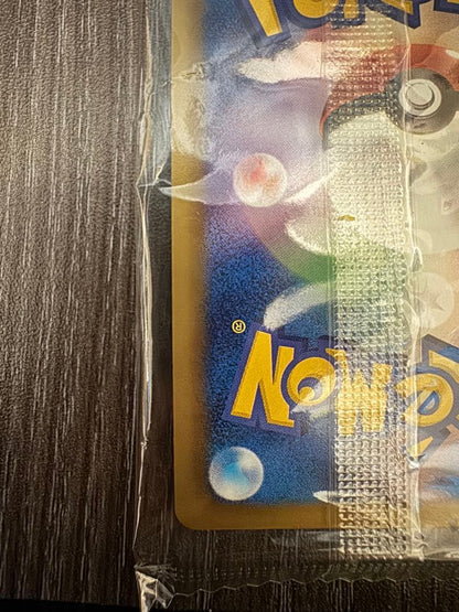 Unopened Pokemon Rekuza P Nobunaga's Ambition First Edition promotional card inside deck case with slight wrinkles on outer bag